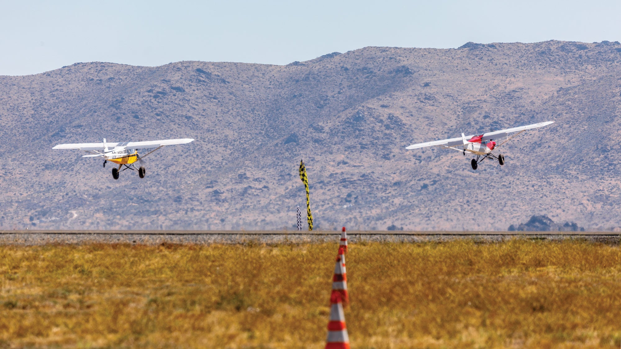 two planes flying side-by-side