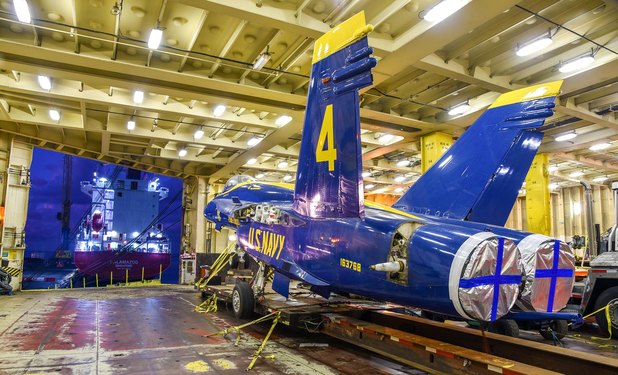 Blue Angel F/A-18C offloading from a ship