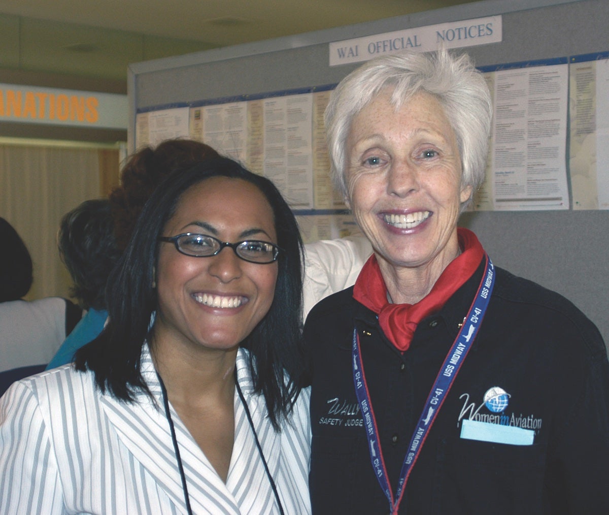 Wally Funk standing with a conference attendee.